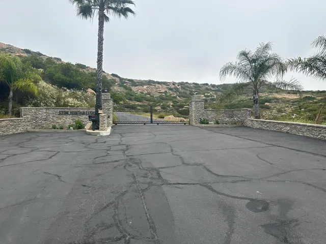 a view of residential houses with yard and mountain view