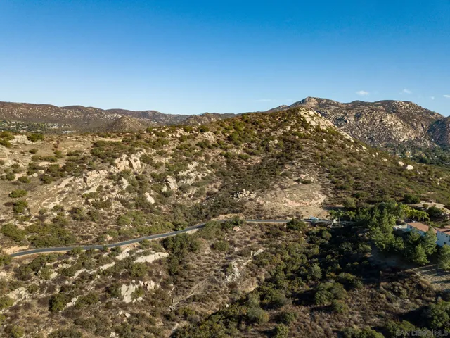 a view of a mountain range with mountains in the background