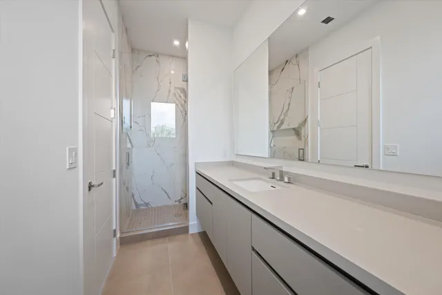 a view of cabinets and washer in a kitchen