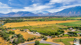 19 East Southfield Road Spanish Fork, UT 84660 - Photo 4 of 74 Aerial view of sparsely populated area featuring a mountain backdrop