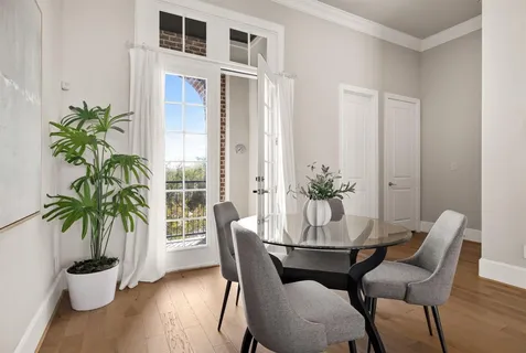 a view of a dining room with furniture window and flowerpot