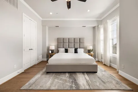 a bedroom with a bed and window