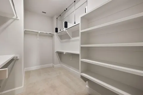 a view of an empty walk in closet