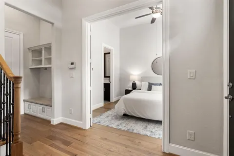 a bedroom with a bed and a mirror