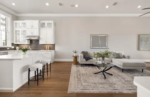 a living room with furniture and a rug