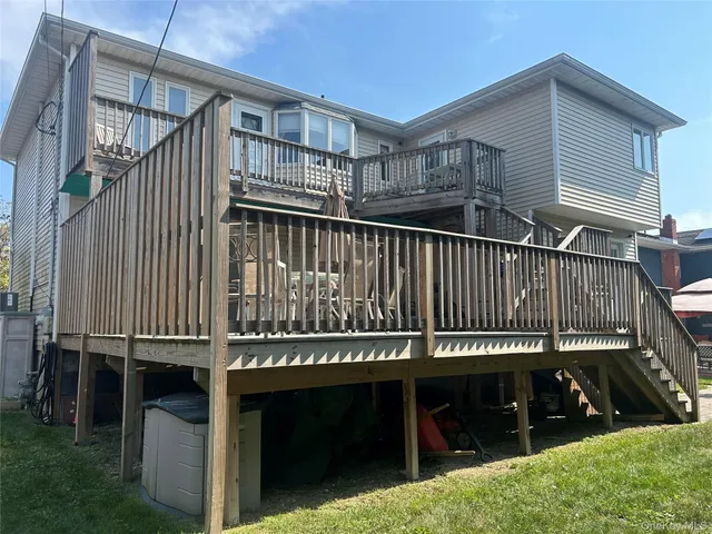 a view of a balcony with wooden floor