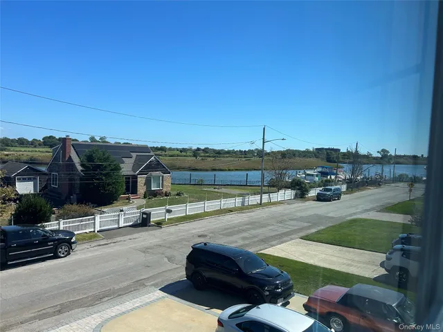 a view of a swimming pool and couches in the patio