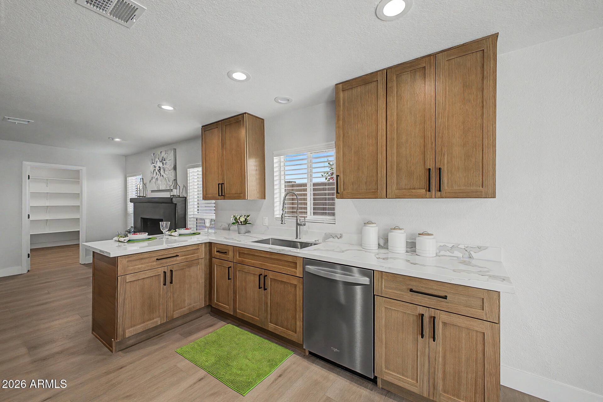 1009 West Pampa Avenue Mesa, AZ 85210 - Photo 8 of 31 a kitchen with a sink stove and cabinets