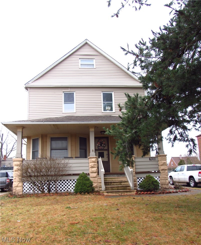 6311 Ridge Road Parma, OH 44129 - Photo 6 of 26 View of front facade featuring a front lawn and a porch