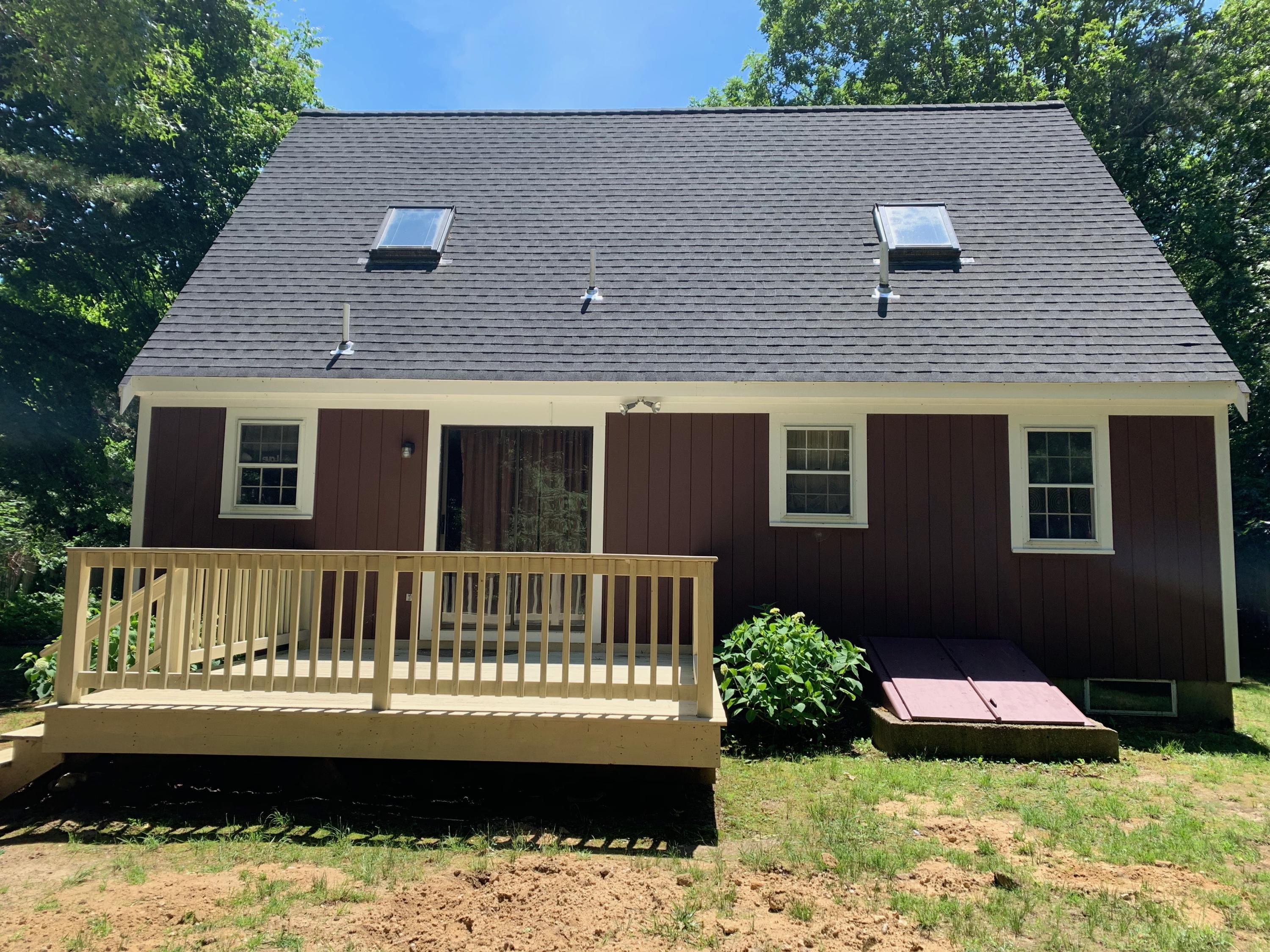 170 Taramac Road Centerville, MA 02632 - Photo 19 of 20 a front view of a house with a yard