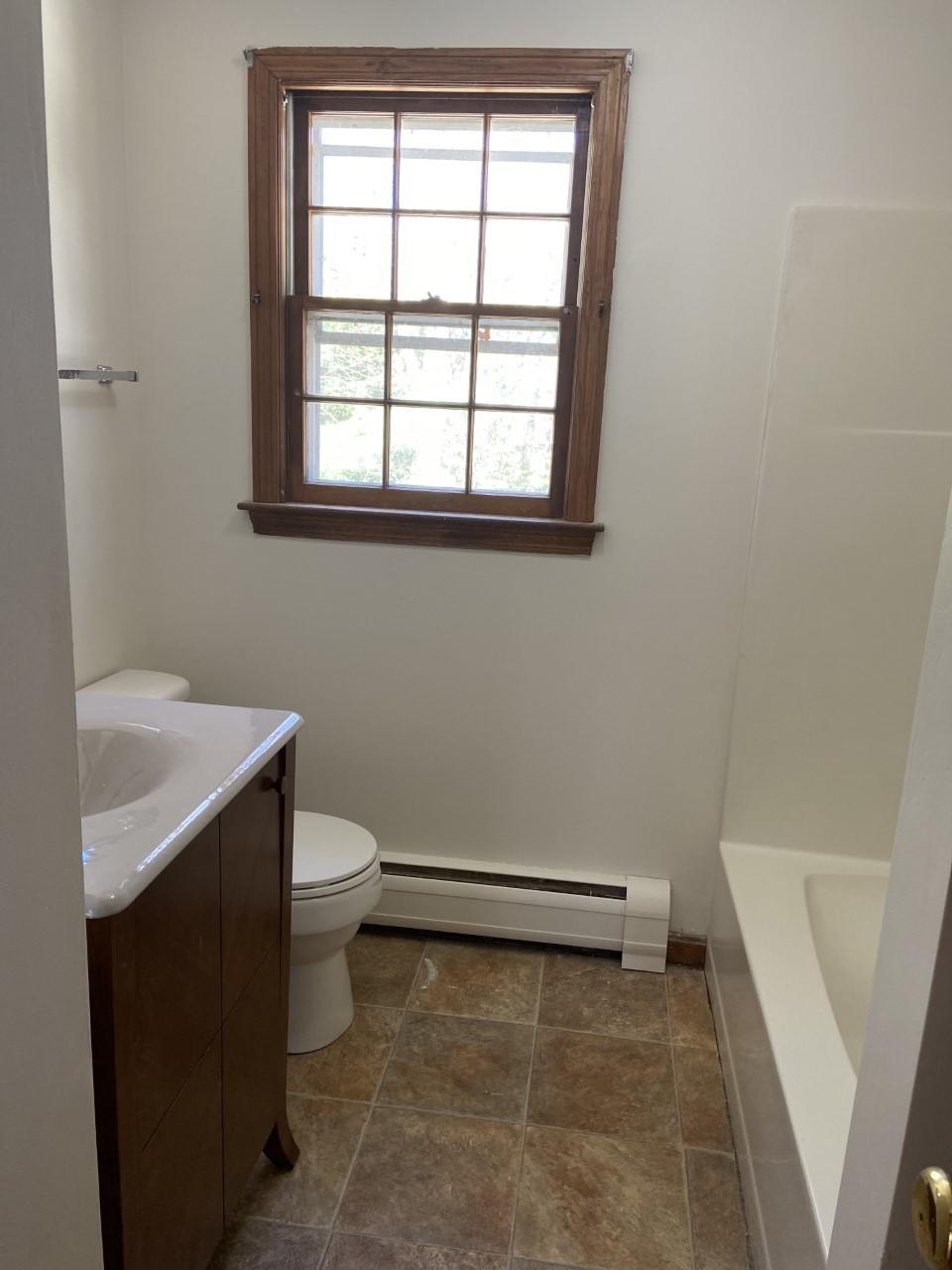 170 Taramac Road Centerville, MA 02632 - Photo 8 of 20 a bathroom with a sink a toilet and a window