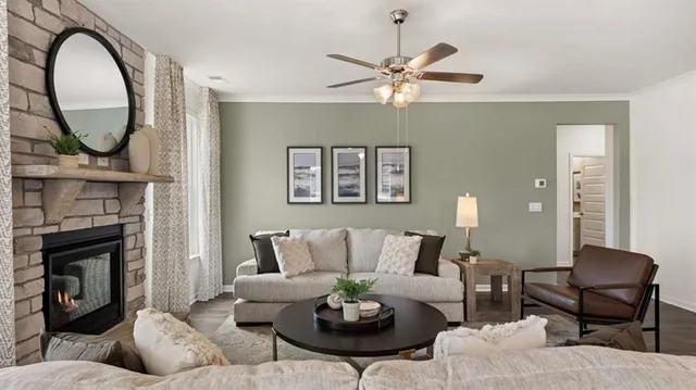 a living room with furniture kitchen view and a chandelier
