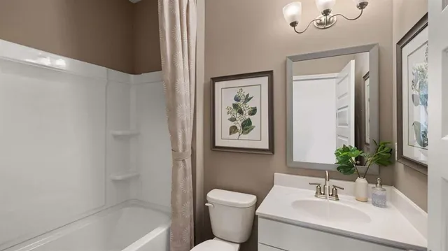 a bedroom with a bed a mirror and a table