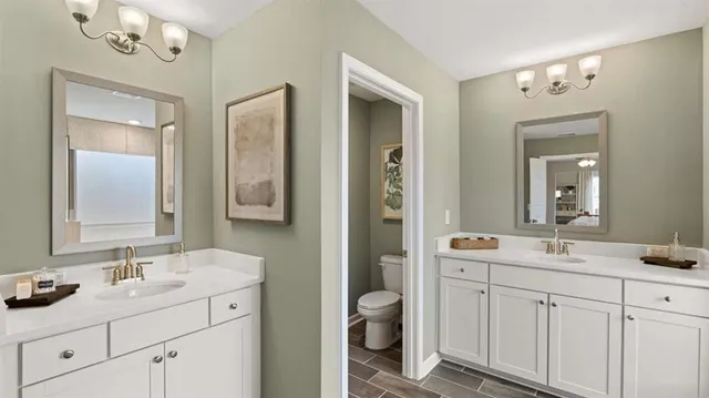 a bathroom with a bathtub sink and mirror