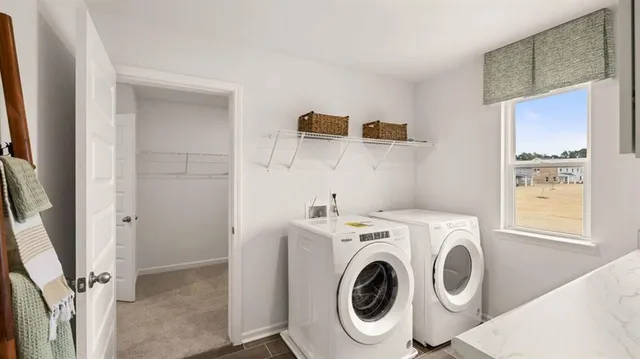 a kitchen with cabinets appliances a sink and a window