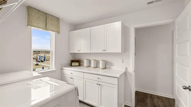 a front view of a house with a yard table and chairs