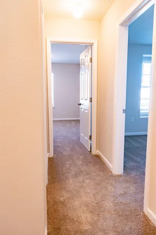 a view of a room with a hallway