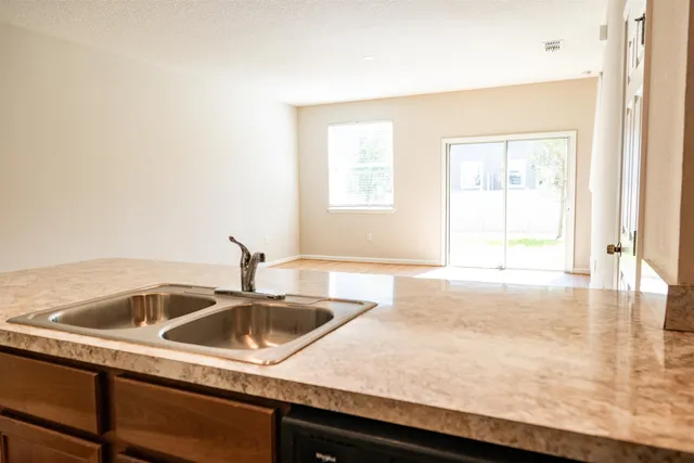 a kitchen with a sink and a window