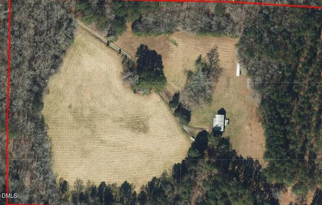 a aerial view of a house with a yard