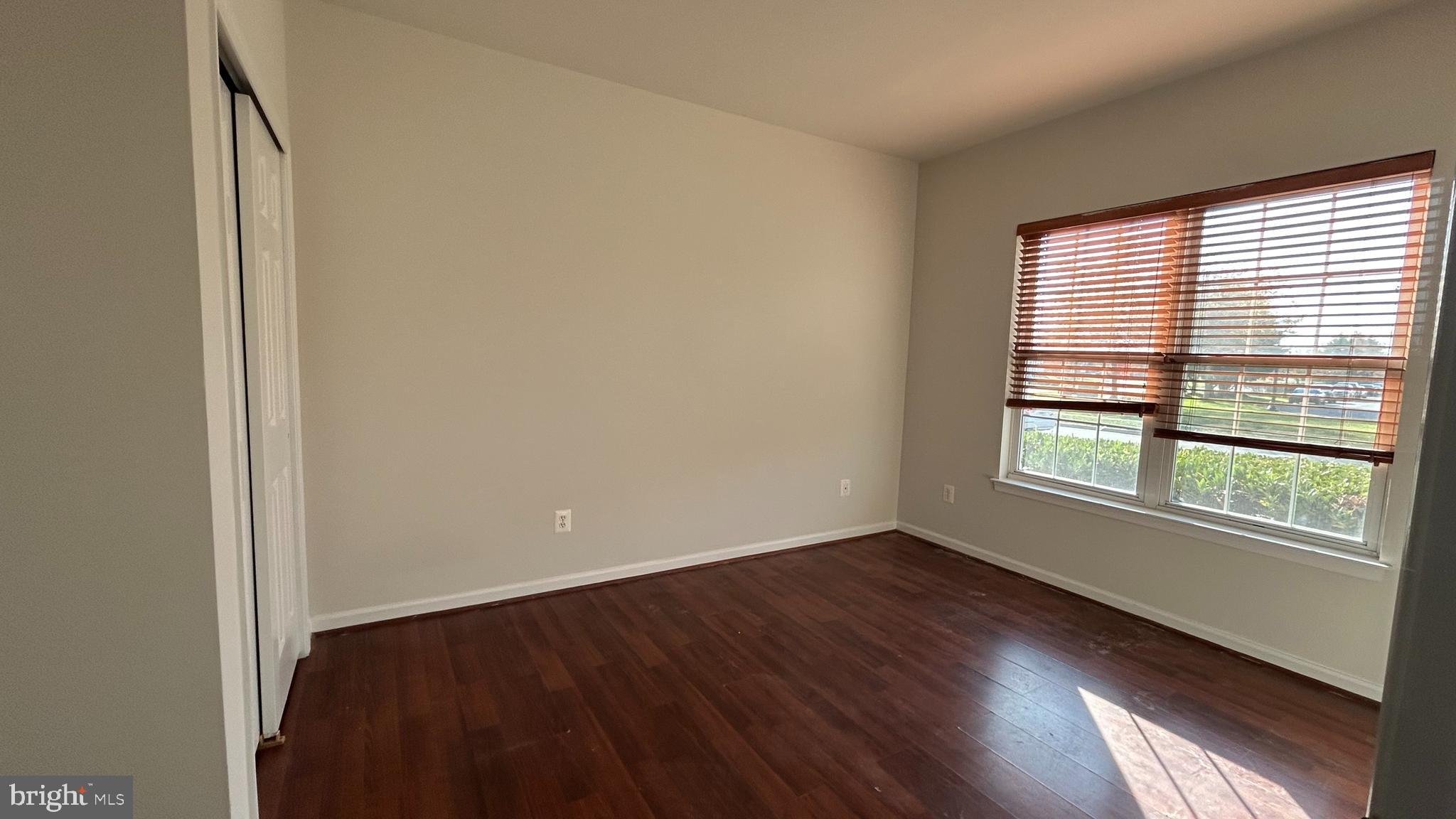 42828 Nations Street Chantilly, VA 20152 - Photo 14 of 19 an empty room with wooden floor and windows