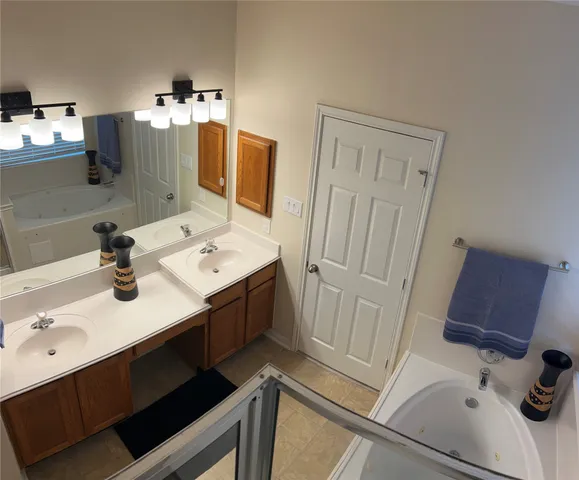 a bathroom with a sink toilet and mirror