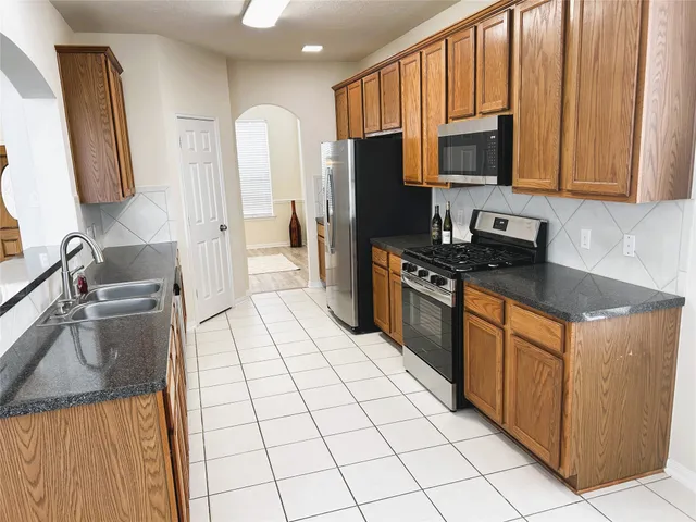 a bathroom with a sink vanity and mirror