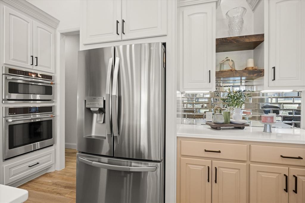 1700 Knox Road Tolar, TX 76476 - Photo 11 of 39 a kitchen with kitchen island a counter top space stainless steel appliances and cabinets