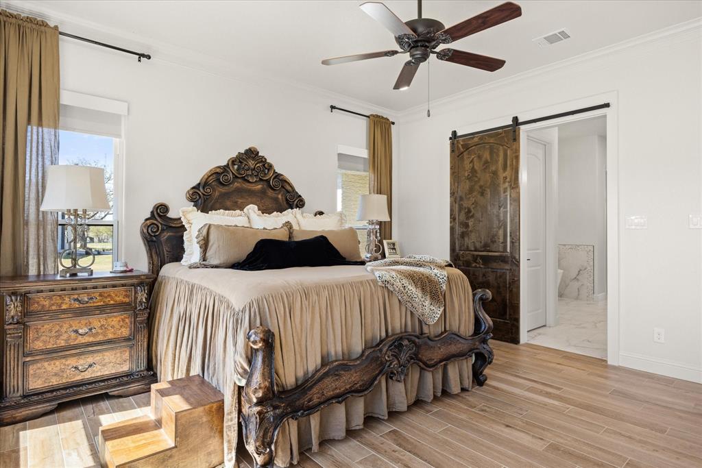 1700 Knox Road Tolar, TX 76476 - Photo 18 of 39 a bedroom with a bed and wooden floor