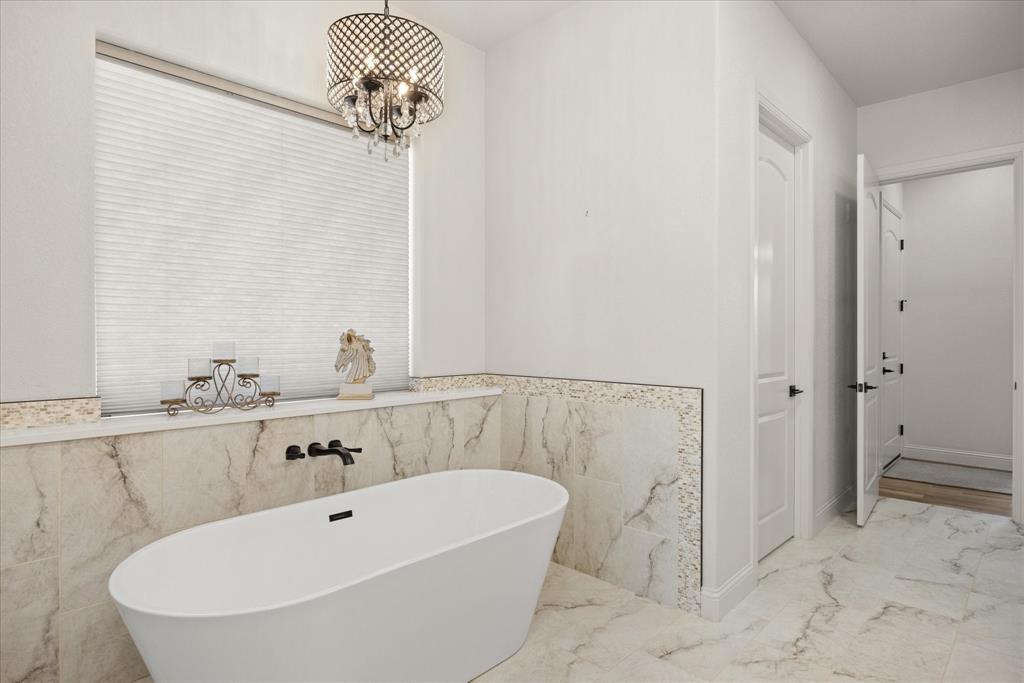 1700 Knox Road Tolar, TX 76476 - Photo 19 of 39 a bathroom with a bathtub and shower