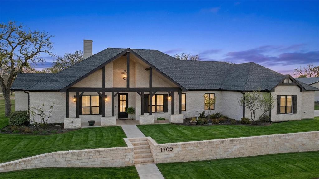 1700 Knox Road Tolar, TX 76476 - Photo 2 of 39 a front view of a house with a yard