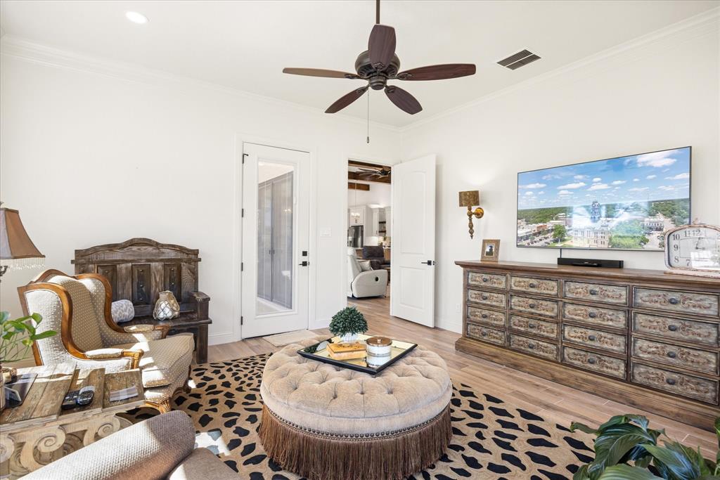 1700 Knox Road Tolar, TX 76476 - Photo 23 of 39 a living room with furniture and a chandelier