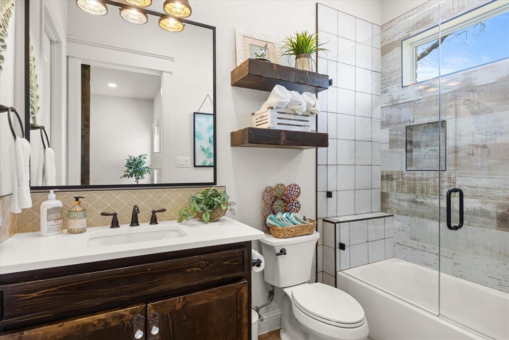 1700 Knox Road Tolar, TX 76476 - Photo 25 of 39 a bathroom with a sink a toilet and shower