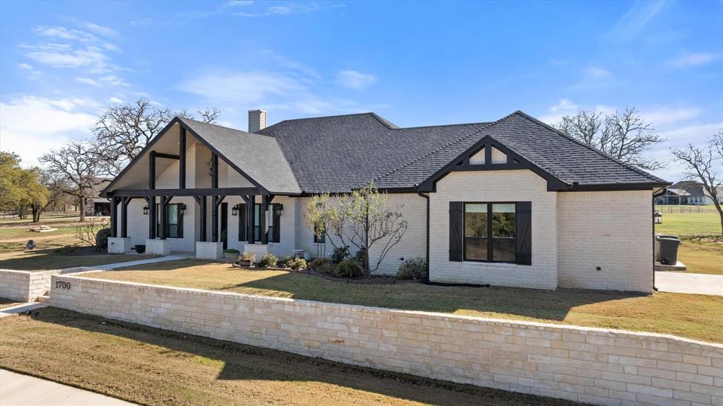 1700 Knox Road Tolar, TX 76476 - Photo 30 of 39 a front view of a house with a yard