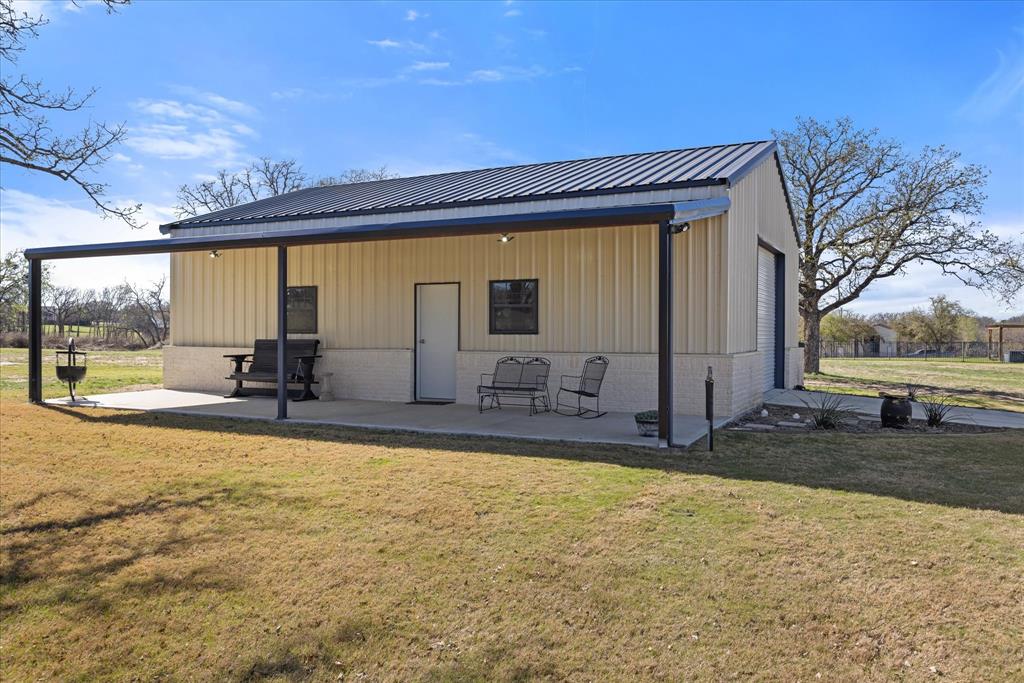 1700 Knox Road Tolar, TX 76476 - Photo 32 of 39 a view of a swimming pool with an outdoor seating