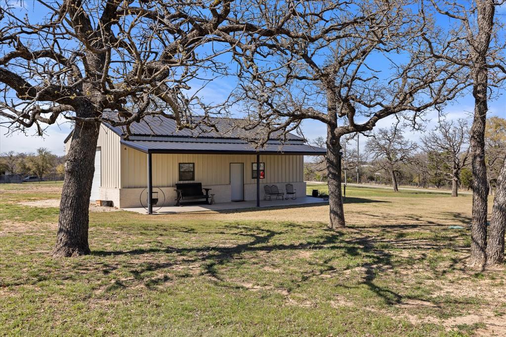 1700 Knox Road Tolar, TX 76476 - Photo 34 of 39 a view of a house with a tree in the yard
