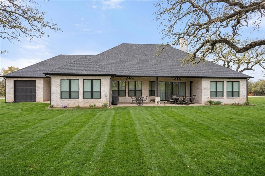 1700 Knox Road Tolar, TX 76476 - Photo 36 of 39 a front view of a house with a yard