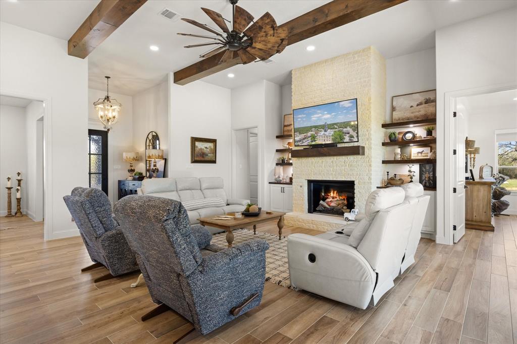 1700 Knox Road Tolar, TX 76476 - Photo 4 of 39 a living room with furniture and a fireplace