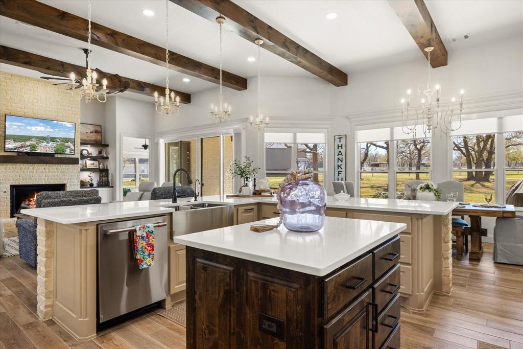 1700 Knox Road Tolar, TX 76476 - Photo 9 of 39 a kitchen with a stove a refrigerator and wooden floor