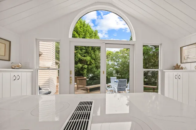 a backyard of a house with plants and trees