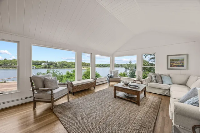 a view of a dining room with furniture wooden floor and chandelier