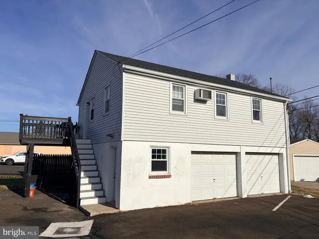 a front view of a house with parking space