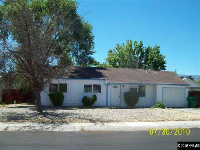 1650 Dayton Way Reno, NV 89502 - Photo 1 of 9 a view of a house with a yard and large tree