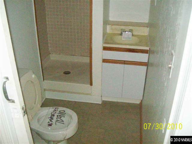 1650 Dayton Way Reno, NV 89502 - Photo 8 of 9 a bathroom with a sink and a mirror