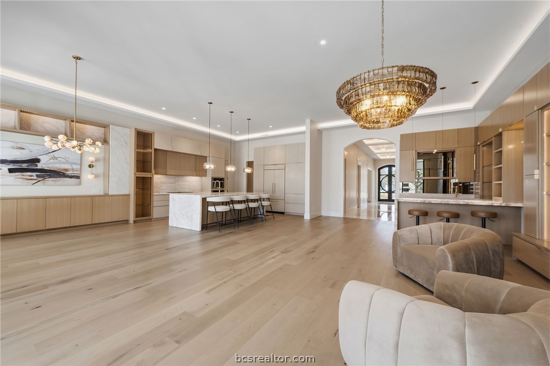 4212 Tuscany Court Bryan, TX 77802 - Photo 14 of 41 a view of a kitchen with furniture and wooden floor
