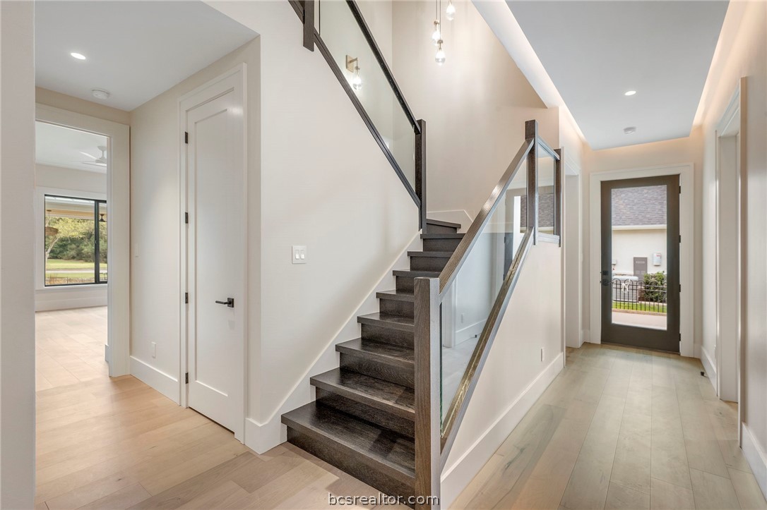 4212 Tuscany Court Bryan, TX 77802 - Photo 28 of 41 a view of entryway with wooden floor and stairs