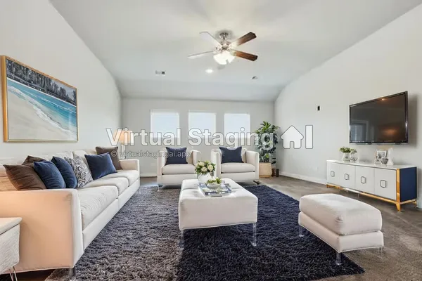 a living room with furniture fireplace and flat screen tv