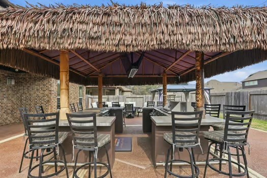 24714 Longwood Forest Drive Spring, TX 77373 - Photo 20 of 21 a view of a chairs and table in patio with a wooden fence