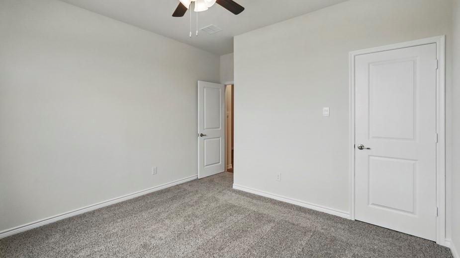 4162 Waldron Trail Forney, TX 75126 - Photo 20 of 29 Room featuring light gray walls, gray carpet flooring, white baseboards, and a ceiling fan