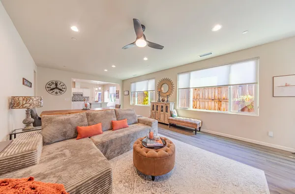 a kitchen with stainless steel appliances granite countertop a sink stove and wooden floor