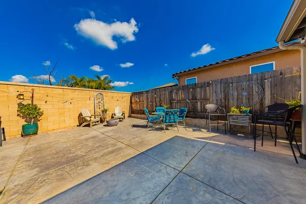 a kitchen with a sink and wooden floor
